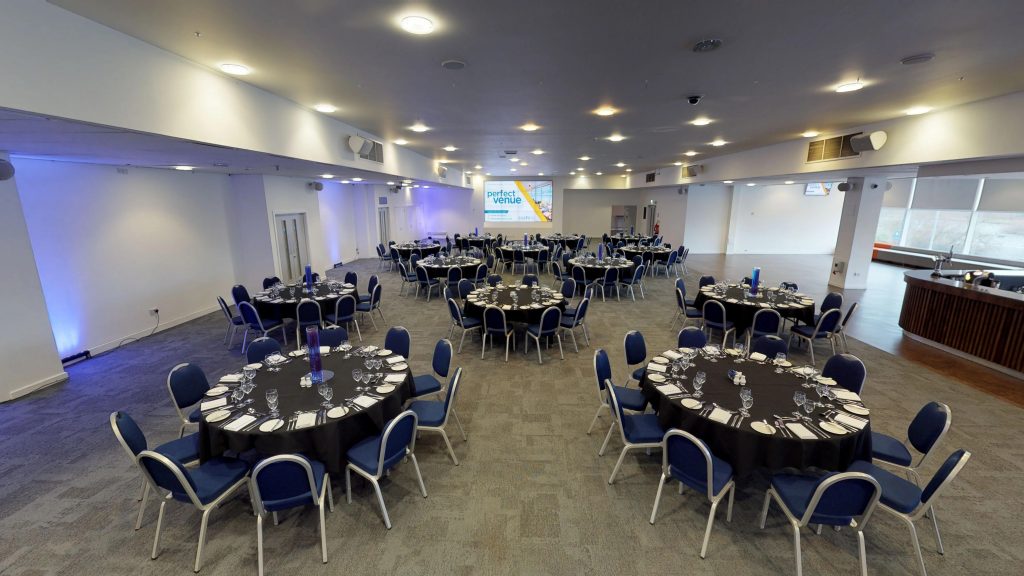 Image of a conference ballroom layout inside the stadium overlooking the pitch