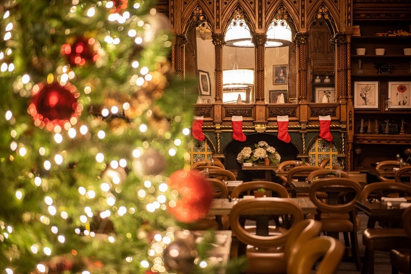 An image of an event space at De Vere Tortworth Estate. The room is decorated for a Christmas Party. 
