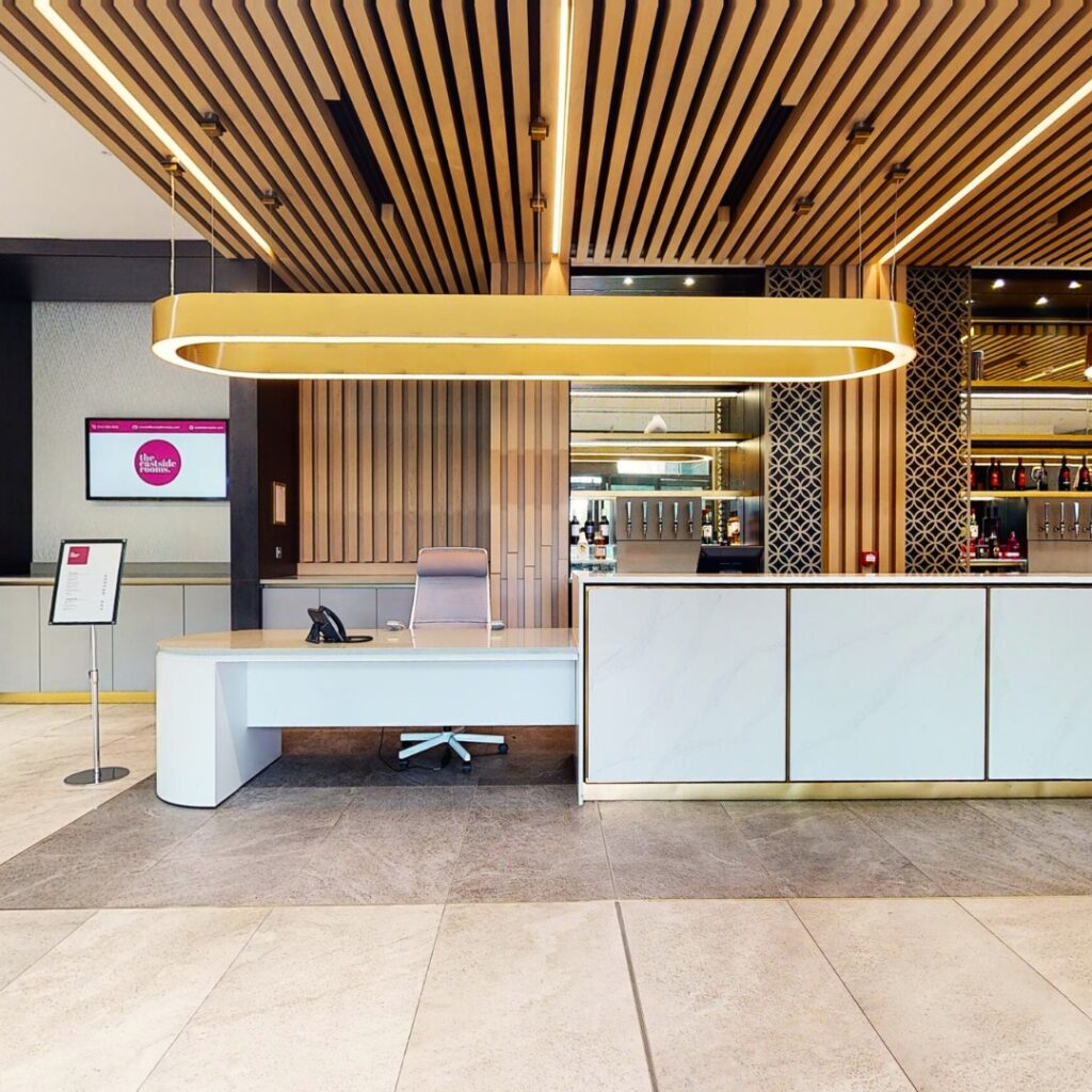 An image of the reception desk at an appropriate height for a wheelchair user.